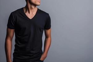 AI generated A young man in a black V neck shirt, isolated on a gray background for a mockup design template photo