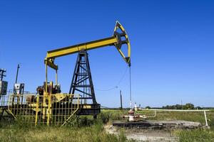 Pumping unit as the oil pump installed on a well photo