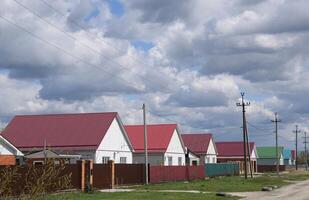 The roof of corrugated sheet on the houses photo