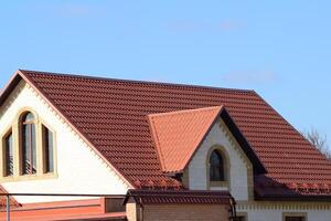 House with a roof made of metal sheets photo