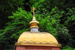 The gilded dome of the Orthodox church. Religious construction and architecture photo