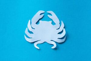 crab paper cut out craft in blue background photo