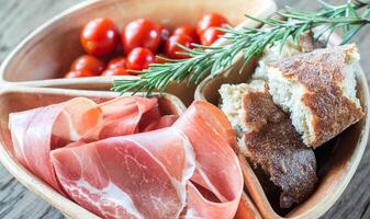 Jamon with bread and cherry tomatoes photo