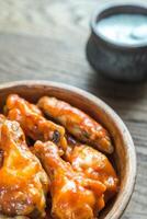 Bowl of buffalo chicken wings photo