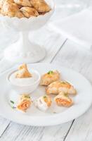 Mini chicken pies with creamy garlic sauce photo