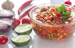 Bowl of salsa with ingredients photo