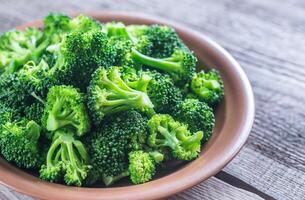 Cooked broccoli on the plate photo