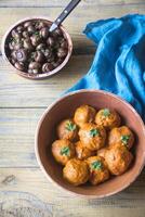 Bowl of turkey meatballs with roasted mushrooms photo