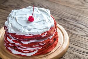 Red velvet crepe cake on the wooden board photo