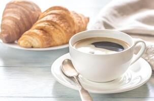 Croissants with cup of coffee photo