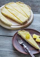 Portion of lemon tart on the plate photo