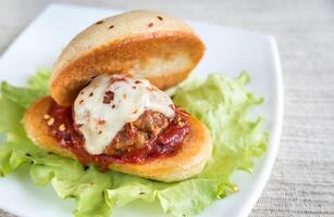 Sandwich with meatball in tomato sauce and mozzarella photo