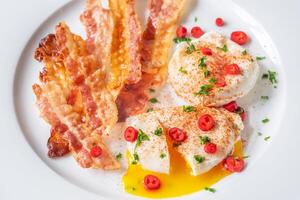 Poached eggs with bacon photo