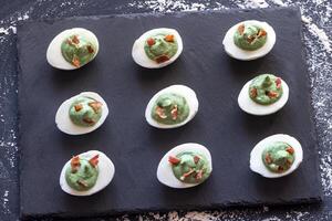 Spinach and bacon deviled eggs photo