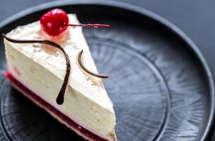 Raspberry cheesecake with sweet cherry photo