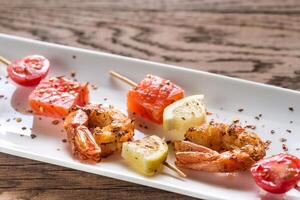 Skewers with shrimps and salmon photo