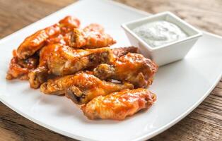 Portion of buffalo chicken wings photo