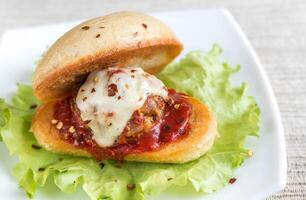 Sandwich with meatball in tomato sauce and mozzarella photo