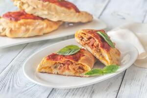 Homemade calzone on the plate photo