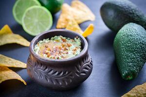 Bowl of guacamole hummus photo