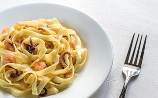 Tagliatelle pasta with seafood photo