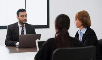 Group of business people working in office and discussing new ideas. boss meeting team for new project photo