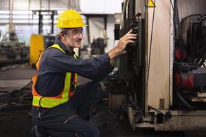 Engineers inspect machines in the factory before use photo