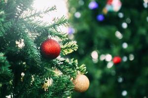 Christmas tree decoration red and gold ball ornaments blurry background photo