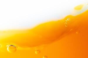 Close up bright orange juice splash texture for health and nature waves, Beautiful waves curve and little bubbles smooth for garphic design and background photo