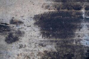 Car oil stains dripping onto cement floor, car engine oil, cement floor, dirt, old, top view, photo