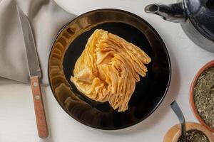 Food of Argentine culture. Fried dessert filled with quince paste or sweet potato paste. photo