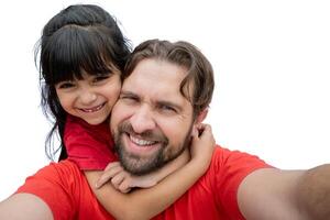 Daughter and her father took a selfie hugging. photo