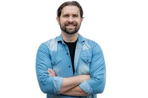 Caucasian Latino dressed casually with arms crossed on a white background. photo