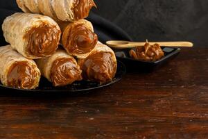 Dulce de leche cannons, typical Argentine dessert. photo