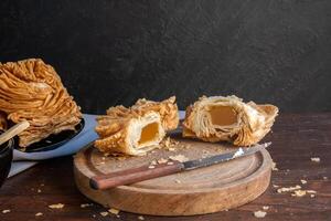 Argentine sweet called pastelito, it is cut in half and you can see the sweet potato filling. photo