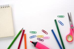 School supplies and office supplies on white background. Learning, study, office equipment and presentation concept. photo