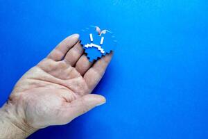 Blue Monday Concept. Hands of a man holding a blue heart. photo
