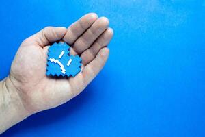 Blue Monday Concept. Hands of a man holding a blue heart. photo