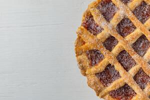 Pastafrola closeup on table wooden photo