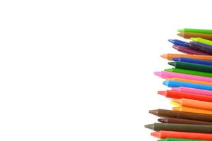 Crayons lined up isolated on white background. photo