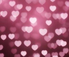 Blurred abstract background with bokeh hearts for valentines day. photo