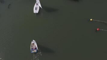 Luxury yachts at Sailing regatta aerial view. Sailing in the wind through the waves at the Lake. Amazing view to Yacht sailing in open sea at windy day video