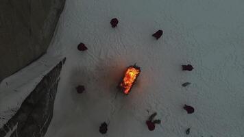 group of monks near the fire in the mountains at dusk, top view. Footage video