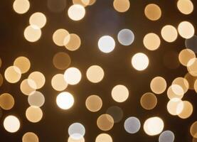 Golden blurred abstract background with golden bokeh photo