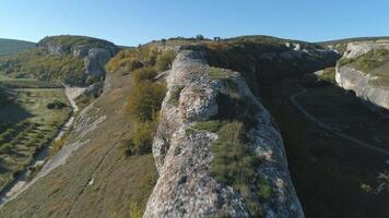 View from gorge on a beautiful valley in sunny day. Shot. Close-up of huge stones on the top. video