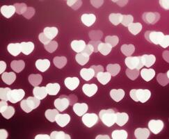 Pink blurred abstract background with cute bokeh hearts for mothers day. photo