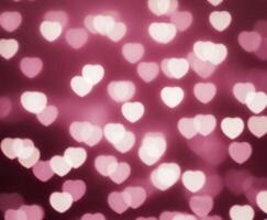 Pink Blurred Abstract Background with Cute Bokeh Hearts for Birthday. photo
