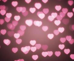 Blurred abstract background with bokeh hearts for valentines day. photo