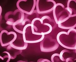 Pink Blurred Abstract Background with Cute Hearts Bokeh for Valentines Day photo