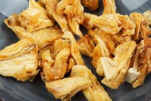 Dried pineapple fruit slices. photo